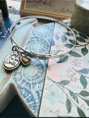 Brighton Silver and Gold Two-Charm Engraved "Joy to the World” Bangle